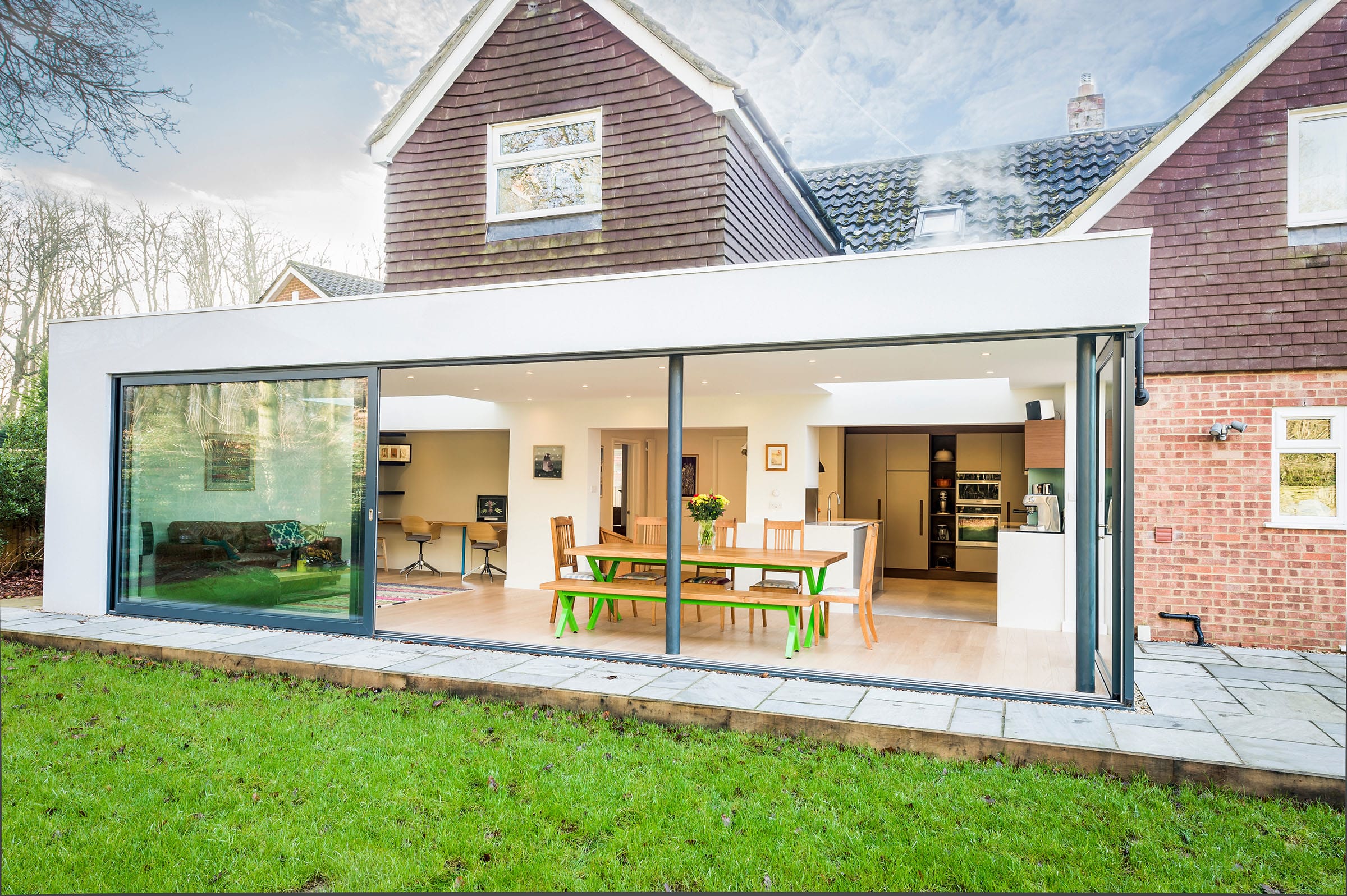 Modern house extension with glass sliding doors.